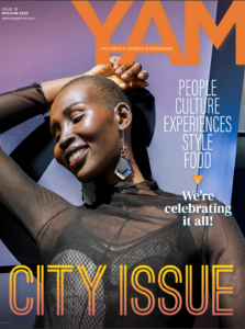 YAM Magazine May-June 2022 cover - City Issue - Black women in net dress smiling with arm up