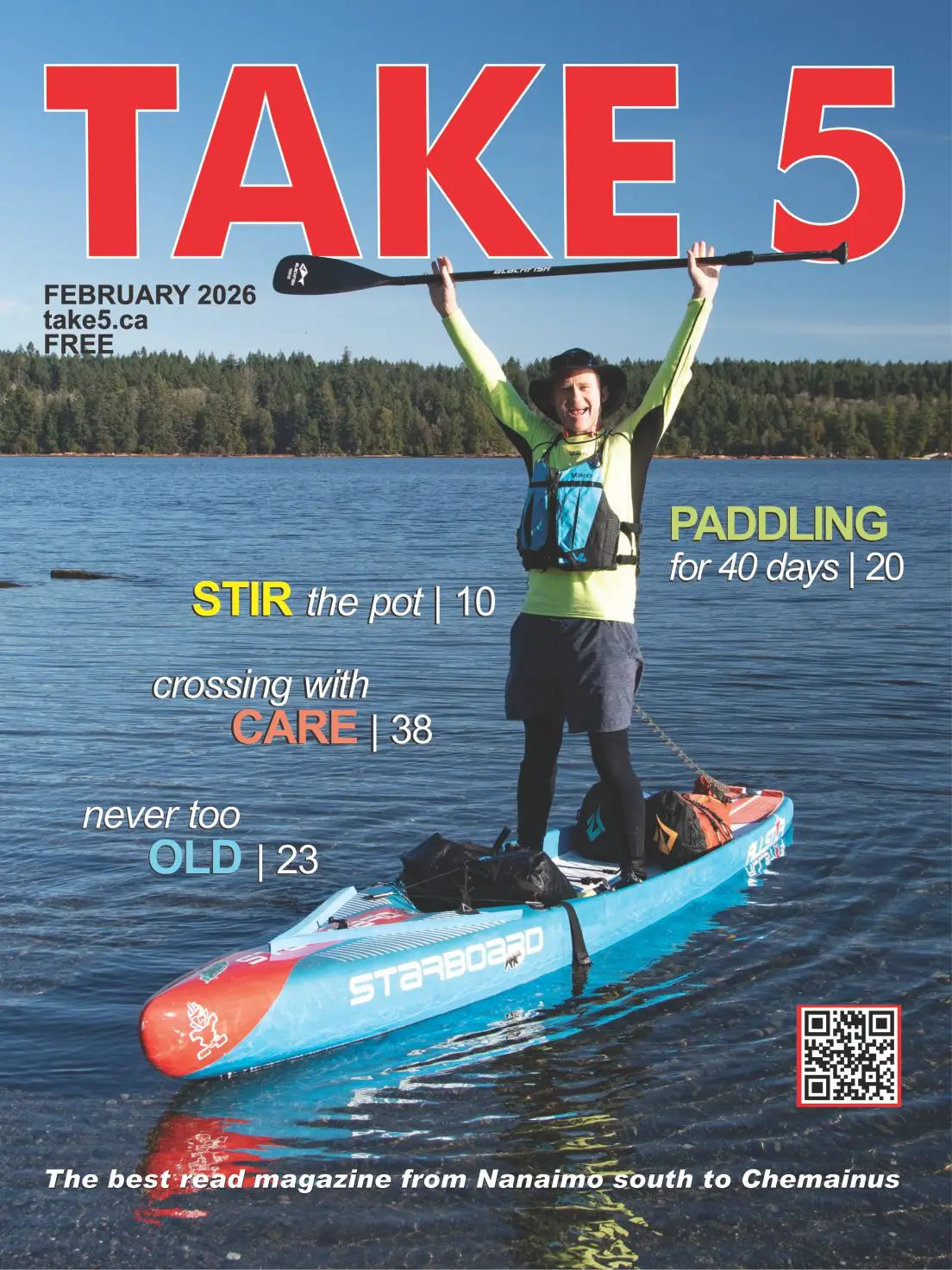 TAKE 5 - Feb 2026 cover man holding paddle aloft standing on boat on water with bags around him.