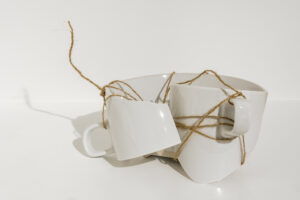 MEND PIECE - Yoko Ono (broken pieces of white mug tied together with twine). Photo: Blain Campbell.