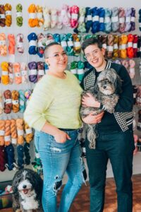 Zoë (left) and their wife Marie-Ève and their dogs Kimchi (in Marie’s arms) and Mister Pickles, at their shop.