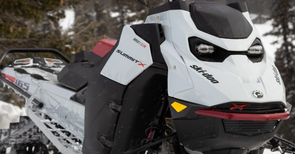 White ski-doo 850 E-TEC Turbo R snowmobile, light snow falling