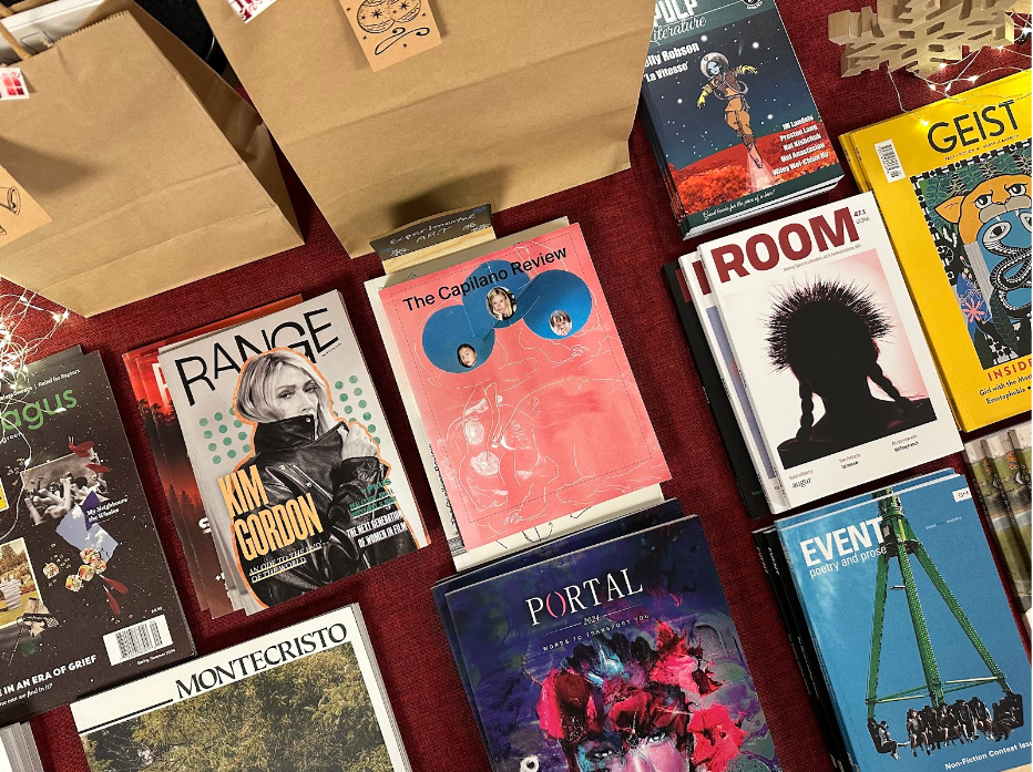 Non-Traditional Newsstand project, section of table set-up at Massey Theatre, New Westminster displaying stacks of MagsBC member magazines.