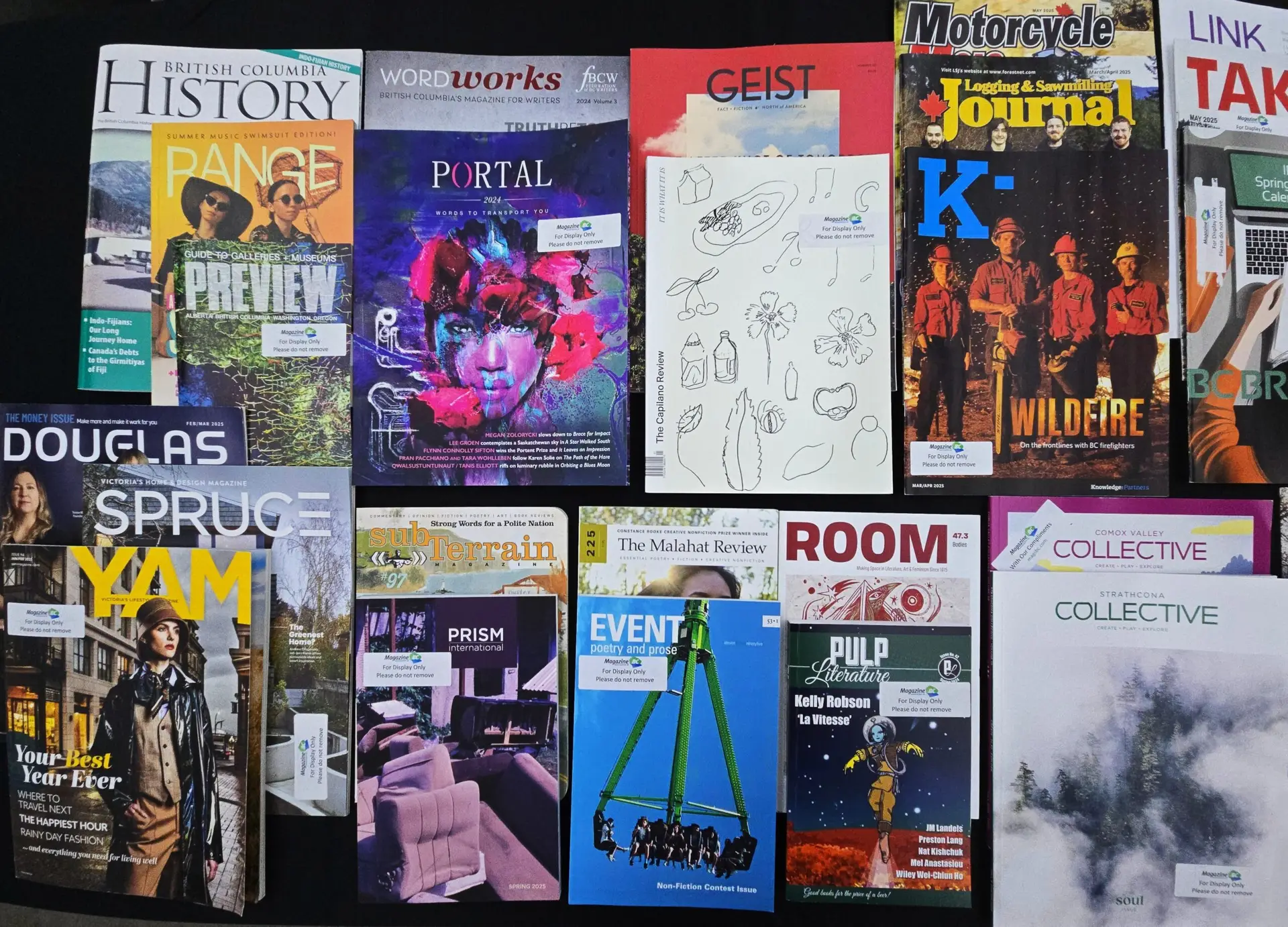 A spread of BC magazines on a black background