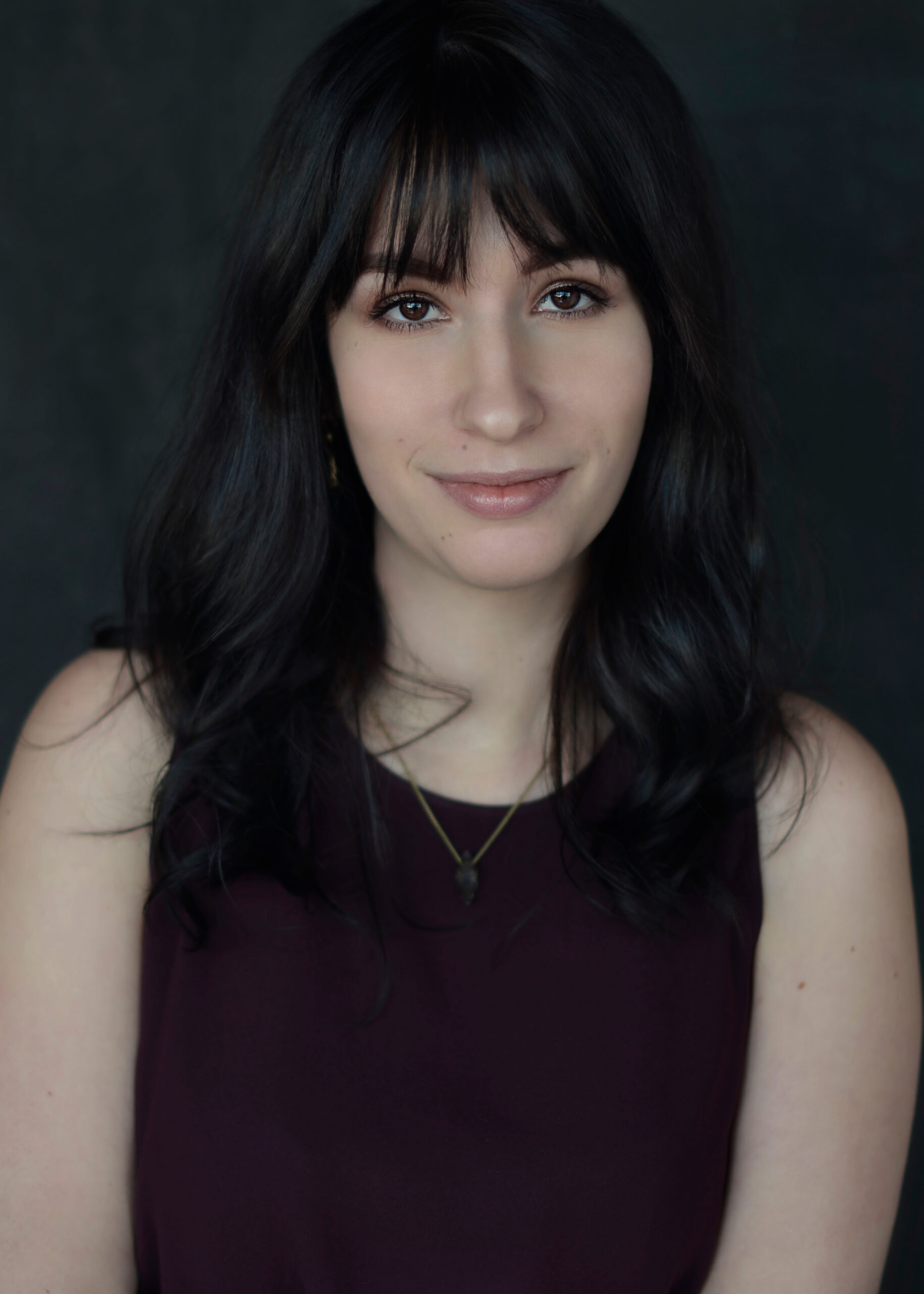 Head and shoulder colour studio portrait of Jessica Key, credit Megan Toriglia
