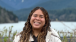 Aniana Domínguez with mountains and a lake in the background, Cleveland Park, BC, March 30, 2024. Photo by Jean Luis Pérez.